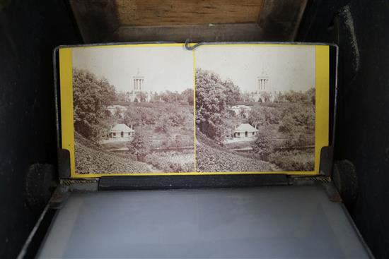 A Victorian burr walnut table top stereoscope viewer with slides/photos